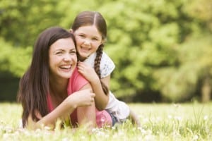 stockfresh_93362_mother-and-daughter-lying-outdoors-smiling_sizeXS-300x200